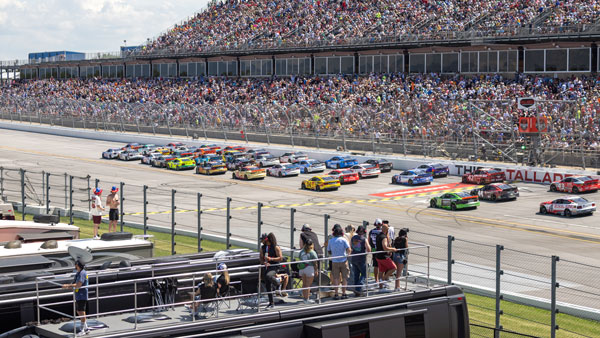 Race fans watching NASCAR from campers at Talladega Superspeedway